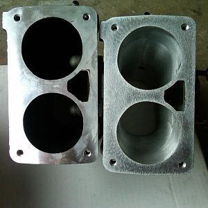 compare ported plenum to stock plenum. Note the aluminum thickness around edges and between intake openings.