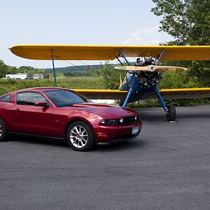 Mustang and biplane