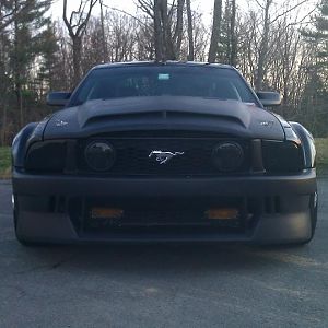 Front Bumber - Flat Black ( Before Paint and modification for built in turn signals.  Had a set of old Fox Body Turn Signals screwed into the wire mes