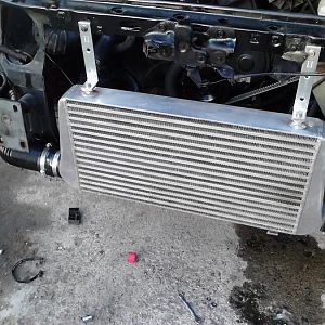 This is a 24in.x12in.x3in. Boost Brothers Intercooler installed in front of the radiator with 3 in plumbing and a K&N Cone filter hidden in the driver
