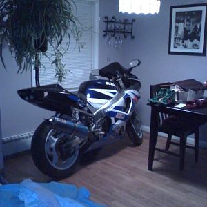 cleaning my bike in my dinning room made a great conversation peice 2000 gsxr 750 polished frame and lots of billet goodies