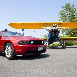 Mustang and biplane