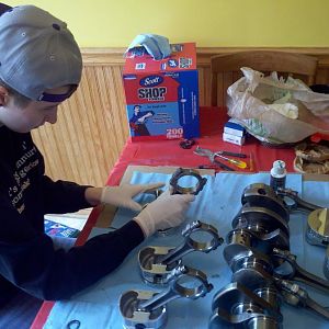 my daughter assembling pistons with me