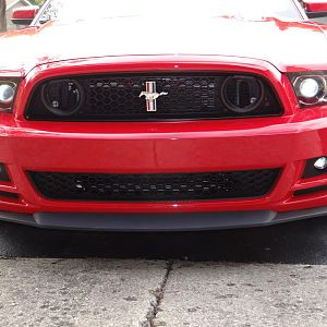 Boss 302S front grille with the Roush front spoiler. Fog light mounted low and the bumper plate holes plugged and painted.