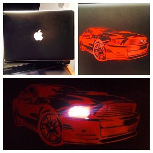 Black vinyl background, ordered plastic black see through case. put case on laptop and applied mustang sticker so the light would be in the headlight