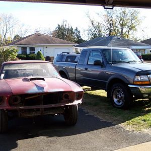 My 69 Mustang Coupe, my 00 Ranger 4X4, & my wife's 08 Escape 4X4 in the background.